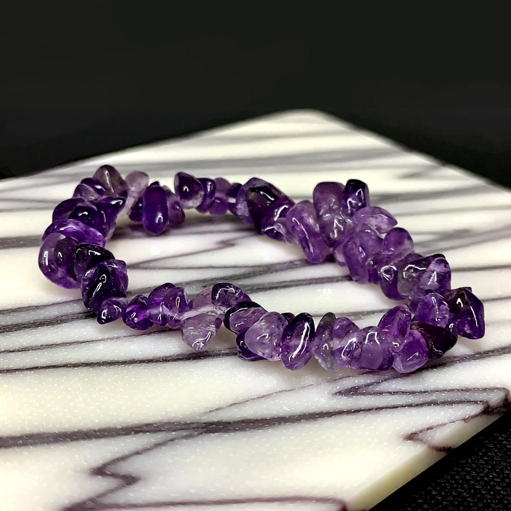 Purple crystal bracelet on a marble surface