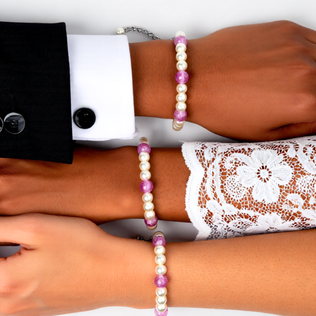 Three people wearing pearl bracelets 